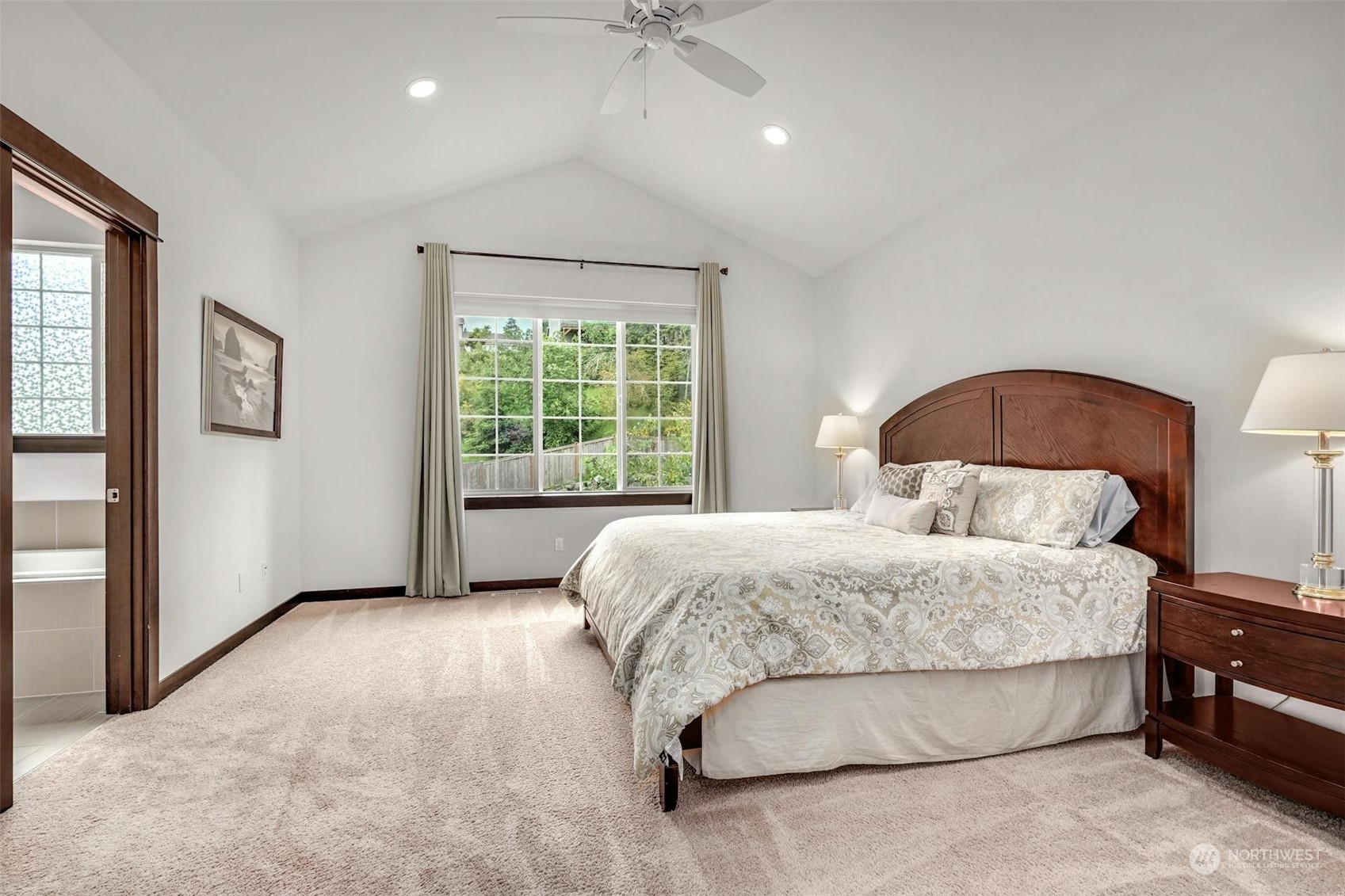 17801 3rd Avenue Southeast Bothell, WA 98012 - Photo 15 of 40 a bedroom with a large bed and a chandelier