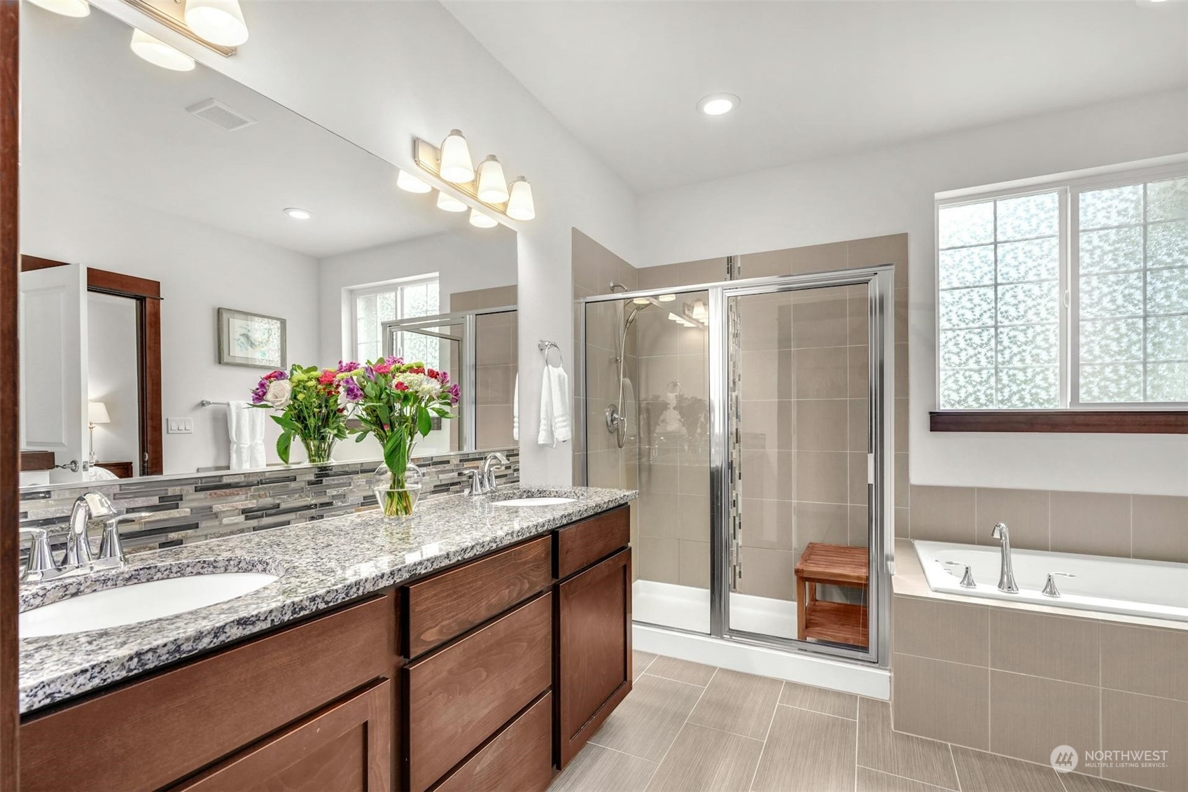 17801 3rd Avenue Southeast Bothell, WA 98012 - Photo 18 of 40 a bathroom with a granite countertop sink a large mirror and a bathtub
