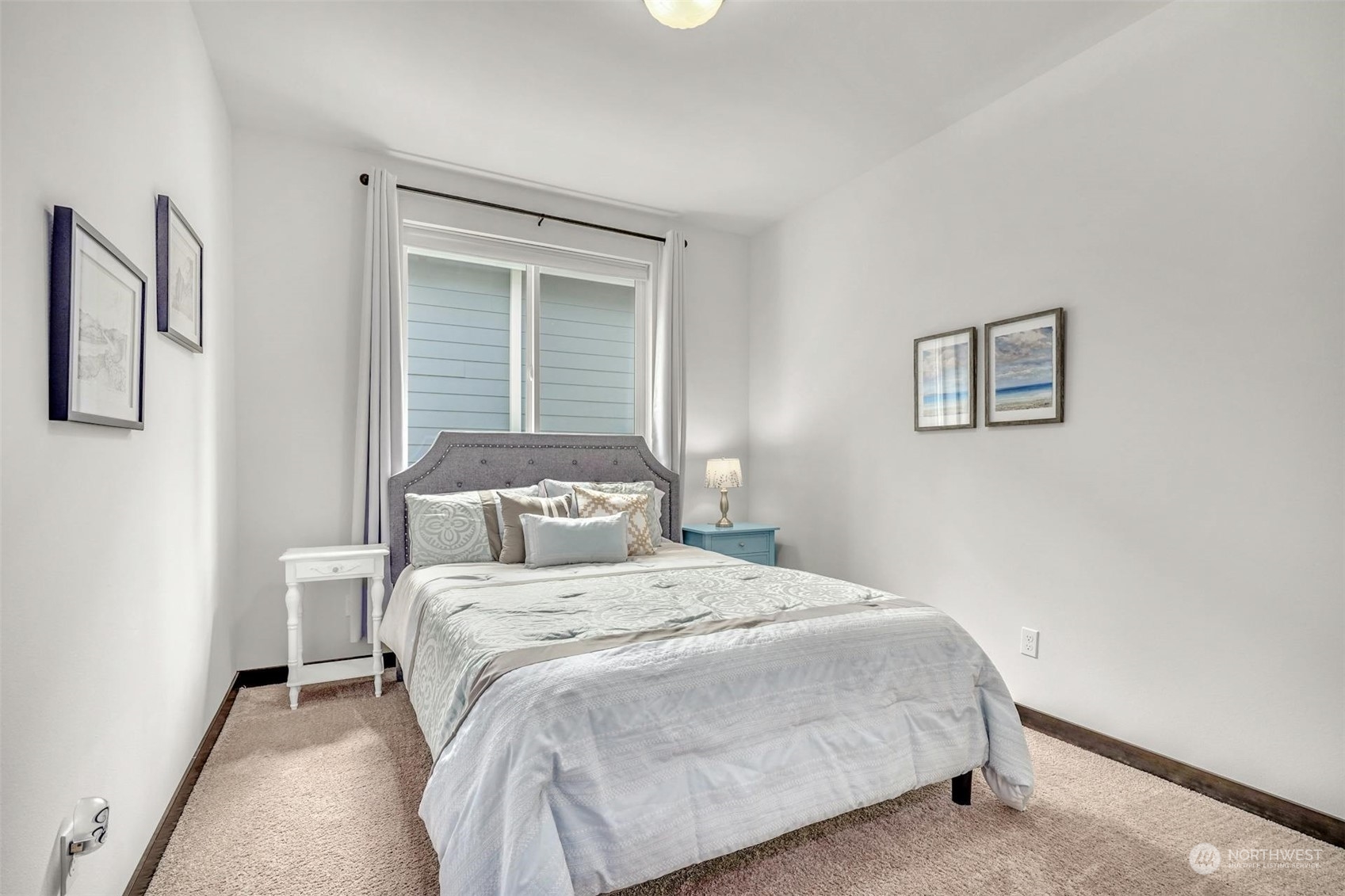 17801 3rd Avenue Southeast Bothell, WA 98012 - Photo 22 of 40 a bedroom with a bed and a painting on the wall