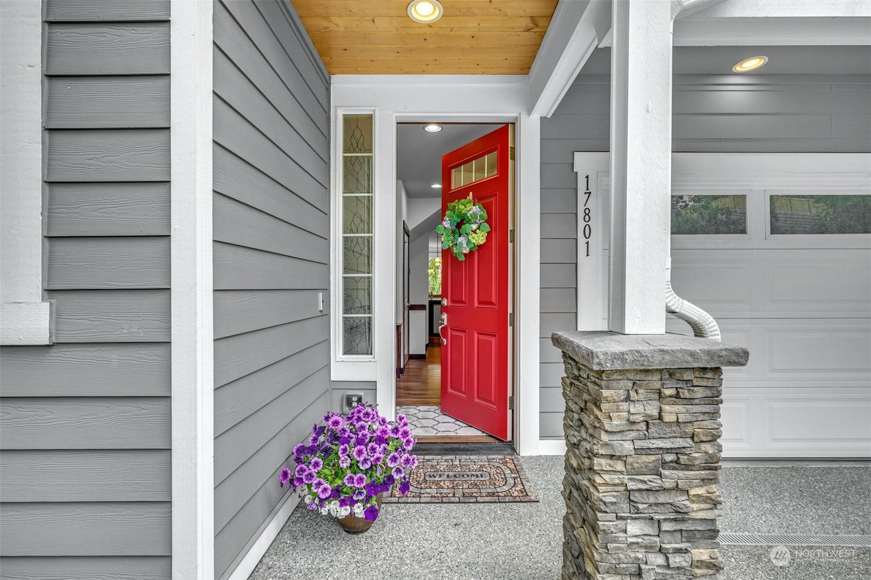 17801 3rd Avenue Southeast Bothell, WA 98012 - Photo 3 of 40 a front view of a house with a potted plant and garage