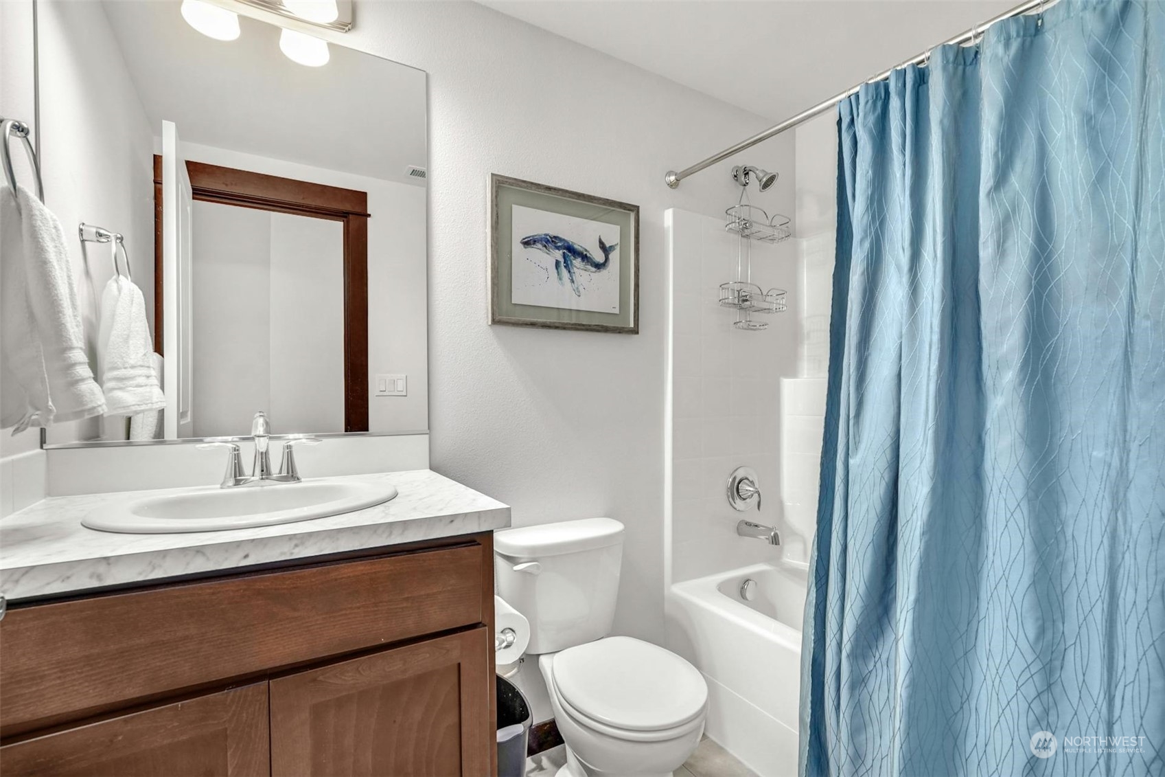 17801 3rd Avenue Southeast Bothell, WA 98012 - Photo 31 of 40 a bathroom with a sink a toilet and shower curtain