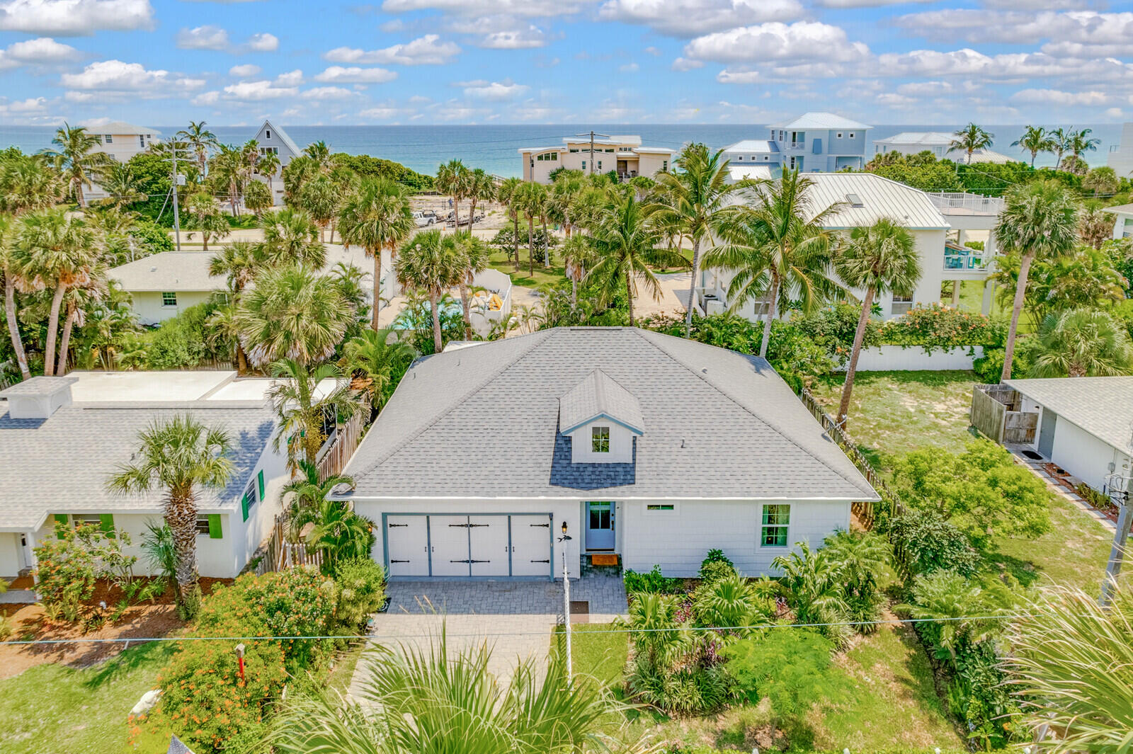 7841 Winona Road Melbourne Beach, FL 32951 - Photo 1 of 2 a aerial view of a house with a yard and potted plants
