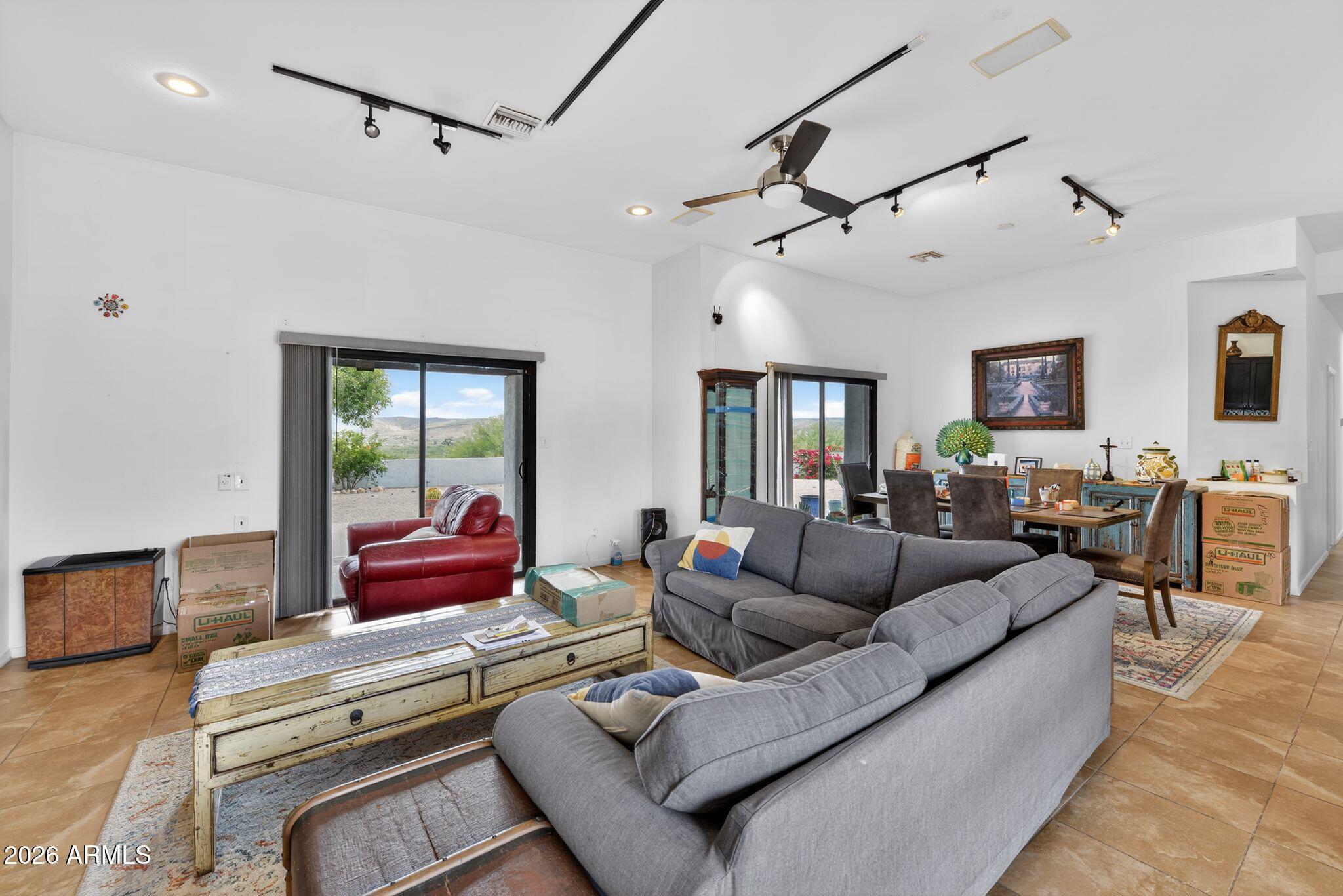 277 Círculo Silva Rio Rico, AZ 85648 - Photo 12 of 34 a living room with furniture and a table
