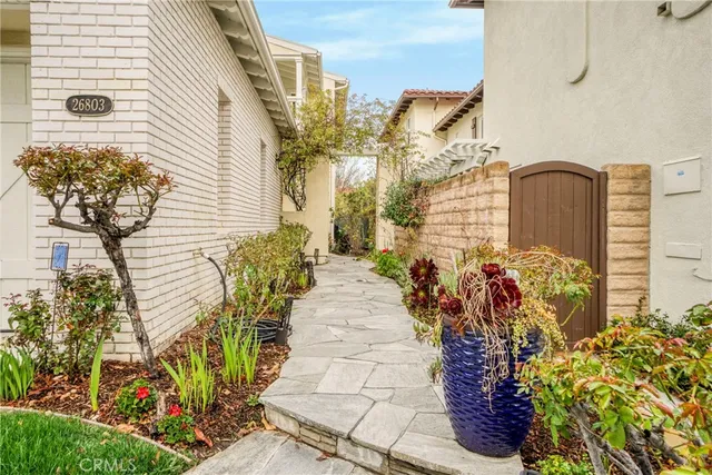 a view of a house with potted plants