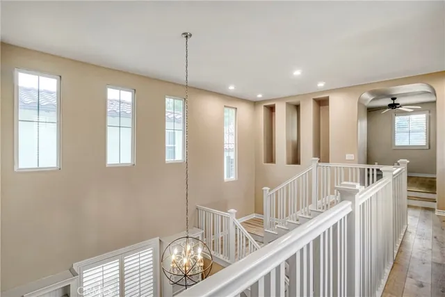 a view of entryway with kitchen and hardwood floor