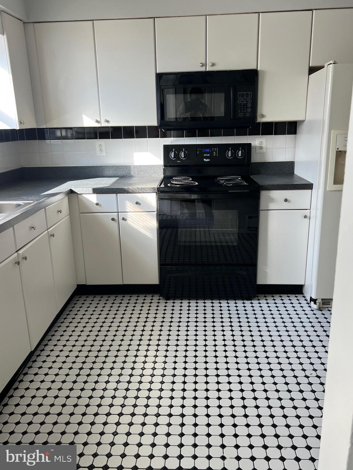55 Noble Road Sicklerville, NJ 08081 - Photo 22 of 22 a kitchen with a sink and a stove