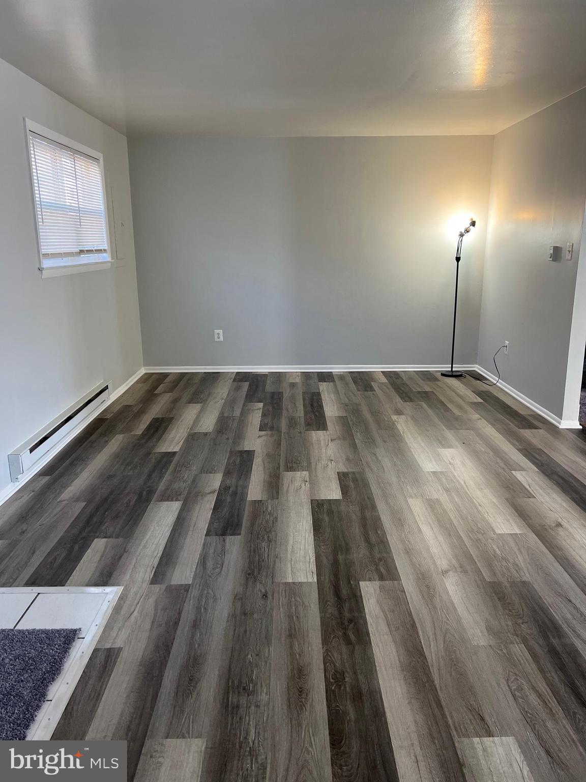 55 Noble Road Sicklerville, NJ 08081 - Photo 3 of 22 an empty room with wooden floor