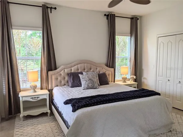 a bedroom with a large bed and a window