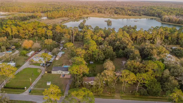 an aerial view of residential building with outdoor space and lake view