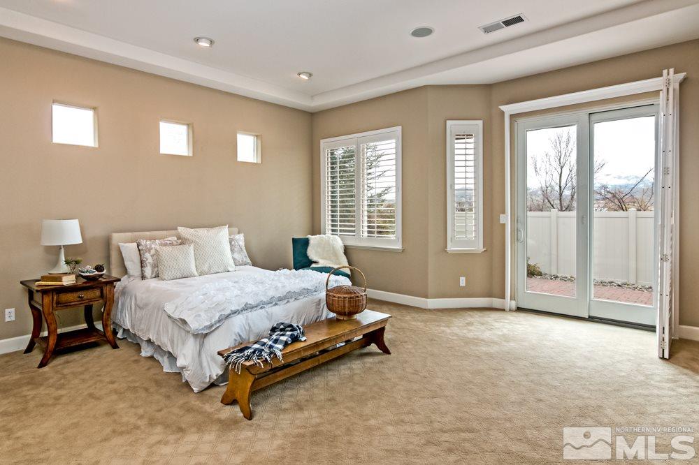 10125 Burghley Lane Reno, NV 89521 - Photo 8 of 13 a bedroom with a bed and large window