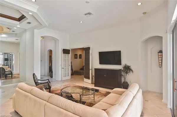 a bedroom with a bed and a couch
