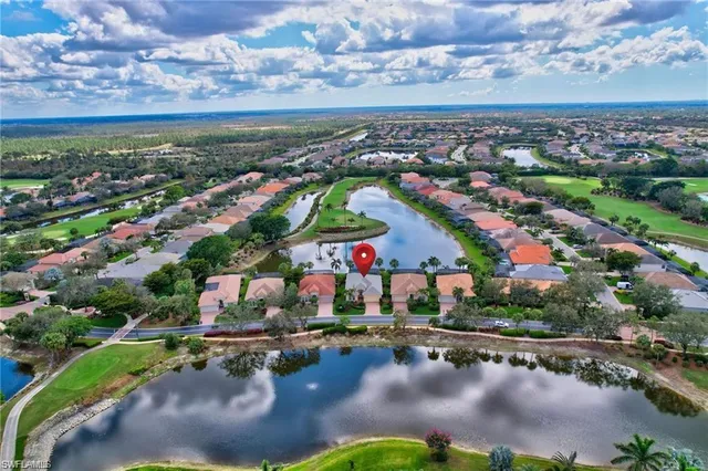 an aerial view of residential building and lake