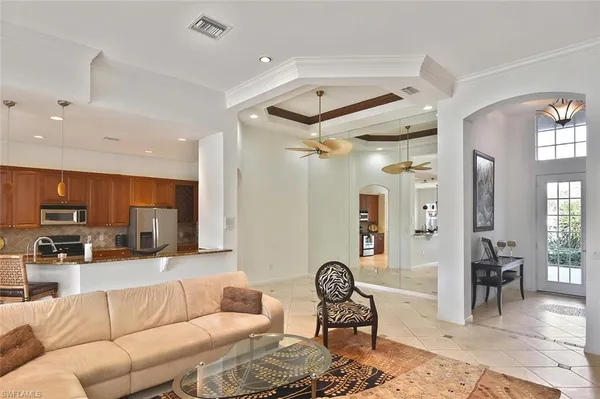 a kitchen with a stove a microwave and wooden cabinets