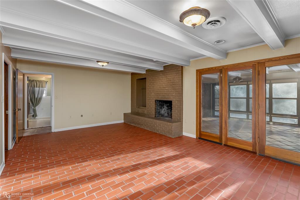 2534 Highway 146 Homer, LA 71040 - Photo 7 of 38 Cozy den with brick pavers leads to sunroom