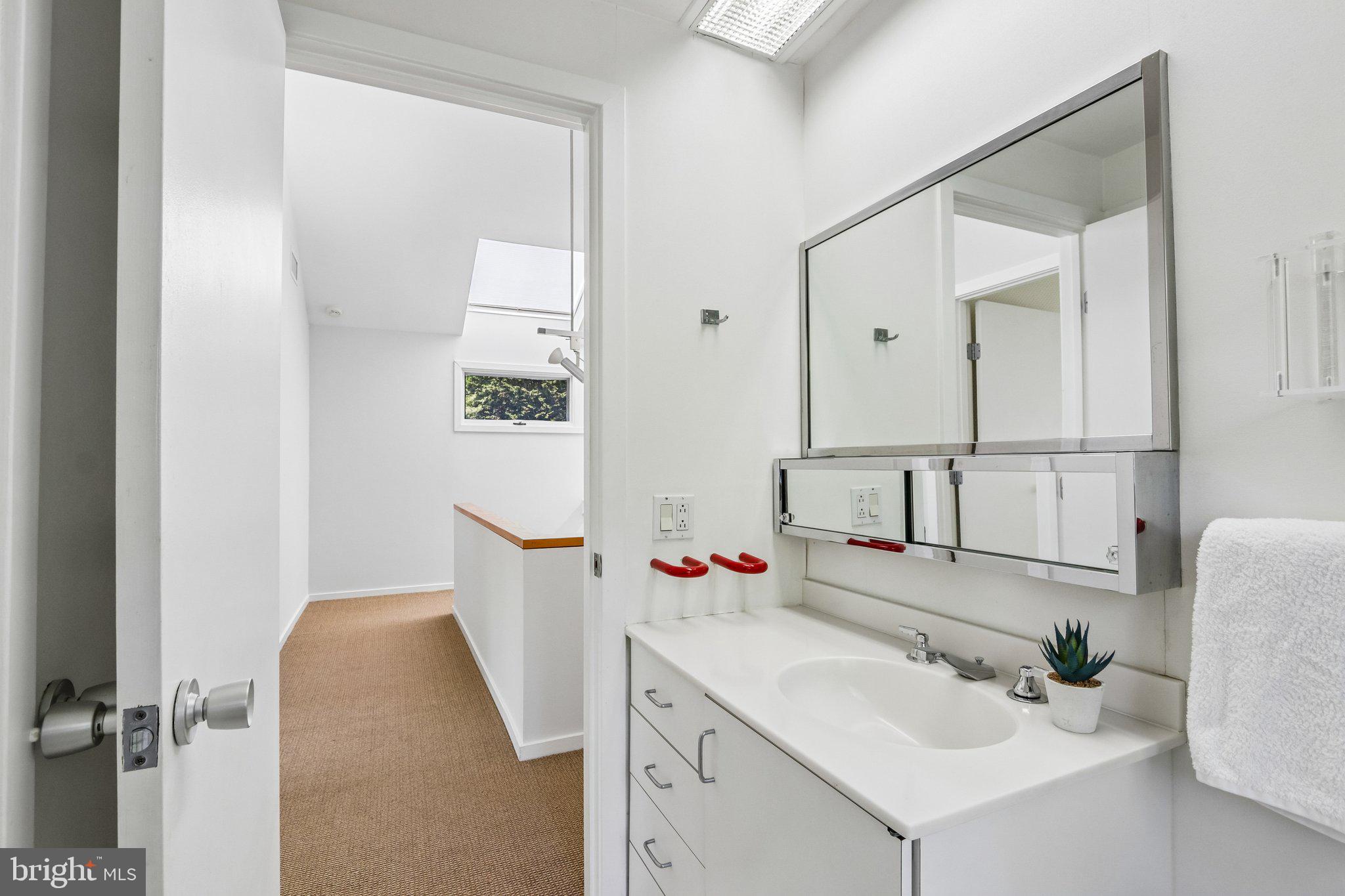 1673 Paper Mill Road Jenkintown, PA 19046 - Photo 42 of 73 a bathroom with a sink vanity and mirror