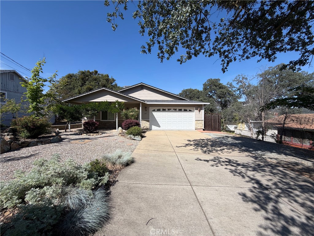 1037 Mark Twain Road Angels Camp, CA 95222 - Photo 5 of 52 a front view of a house with garden