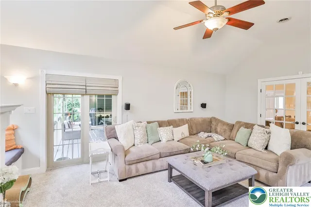 a view of a hallway with a chandelier and entryway
