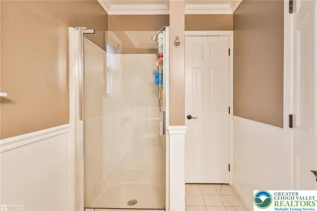 a bedroom with furniture and a fireplace