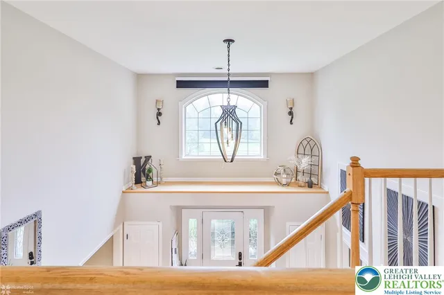 a bathroom with a granite countertop sink toilet mirror and bathtub