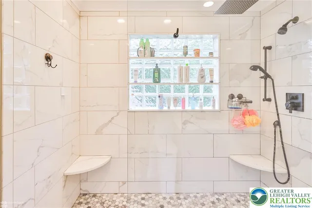 a living room with lots of furniture and a wooden floor