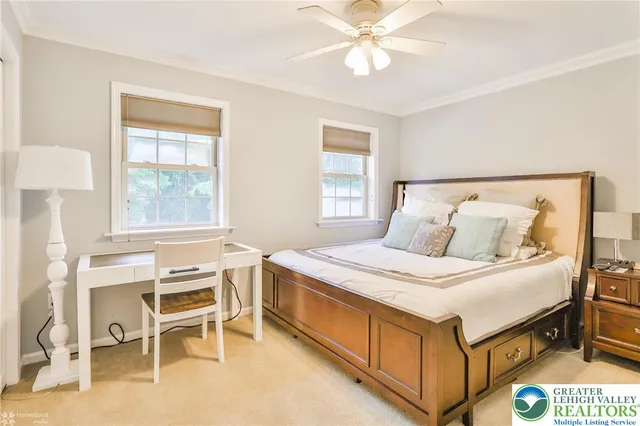 a bathroom with a double vanity sink toilet and a mirror