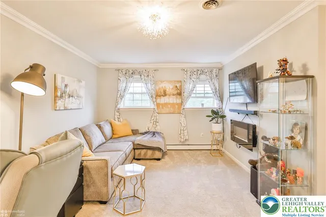 a balcony with furniture and wooden floor