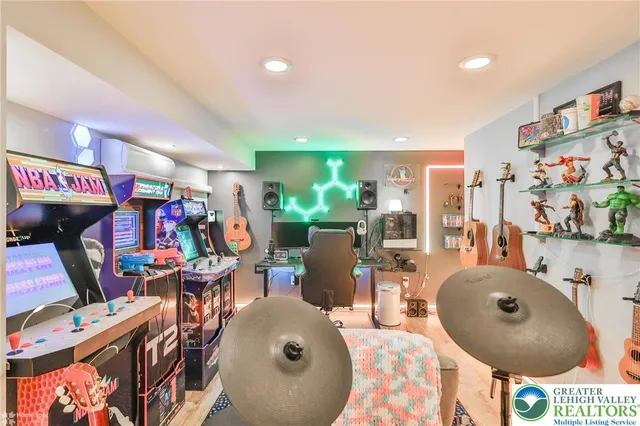 a living room with fireplace furniture and a large window