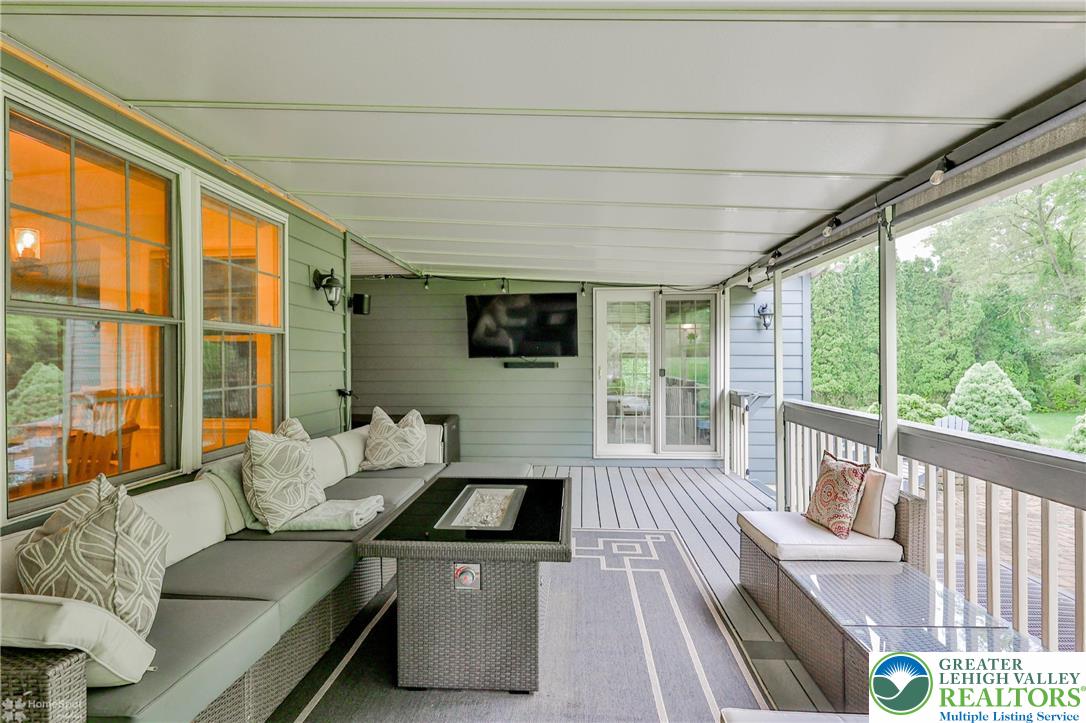 1147 Jacobsburg Road Wind Gap, PA 18091 - Photo 58 of 70 a living room with furniture tv and a large window