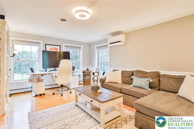 a living room with furniture and a table