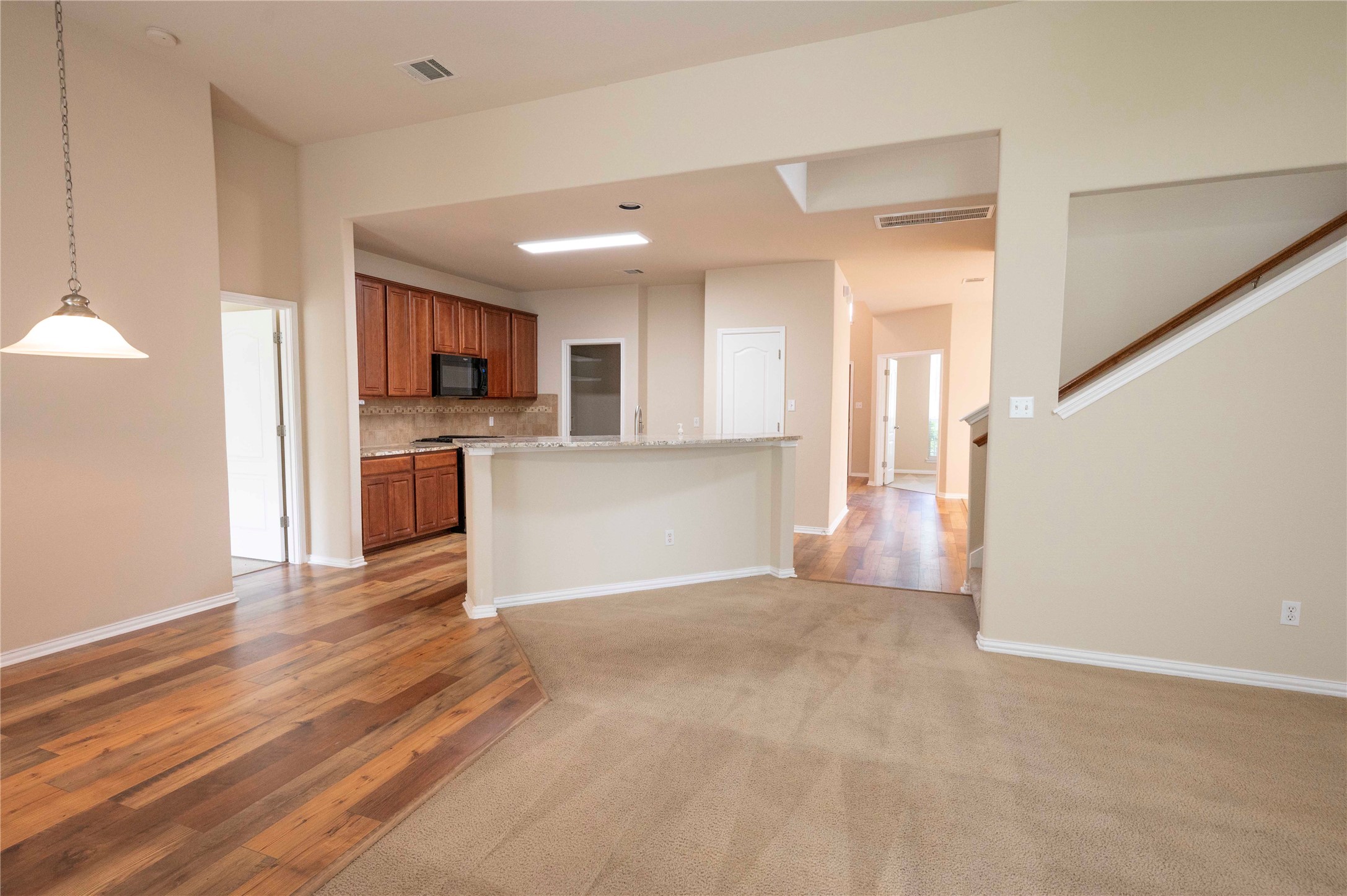 2070 Intrepid Drive Buda, TX 78610 - Photo 31 of 31 An open floor plan seamlessly connects the living area to a modern kitchen.