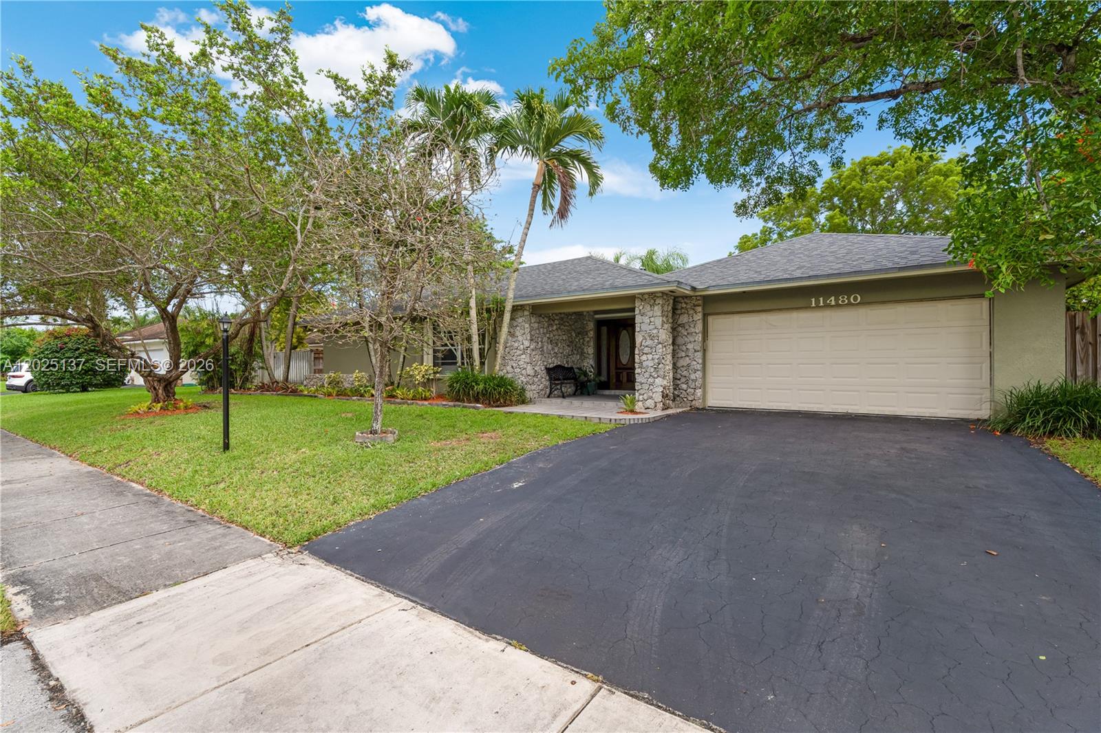 11480 Southwest 96th Terrace Miami, FL 33176 - Photo 2 of 54 a front view of house with yard and green space