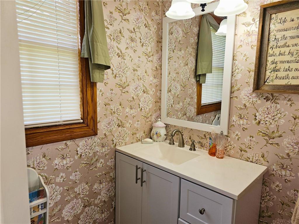 685 South Keel Ridge Road Hermitage, PA 16148 - Photo 14 of 42 a bathroom with a sink and a mirror