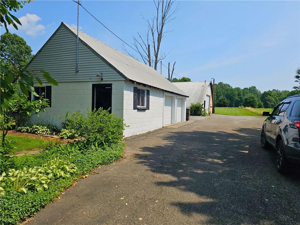 685 South Keel Ridge Road Hermitage, PA 16148 - Photo 23 of 42 a front view of a house with a yard and garage
