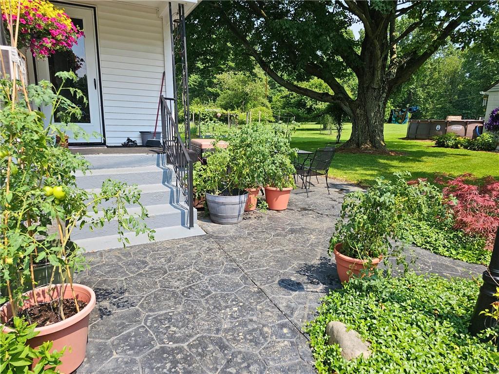 685 South Keel Ridge Road Hermitage, PA 16148 - Photo 4 of 42 a view of a backyard with chair and flower plants