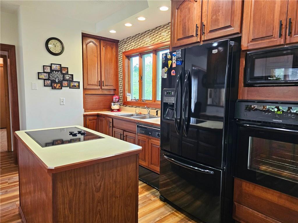 685 South Keel Ridge Road Hermitage, PA 16148 - Photo 8 of 42 a kitchen with stainless steel appliances granite countertop a stove a sink and a refrigerator