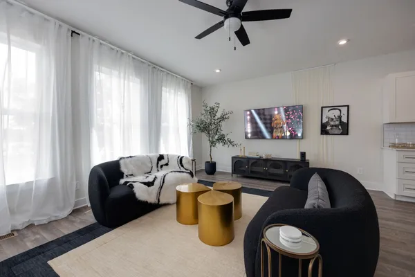 a living room with furniture and a window
