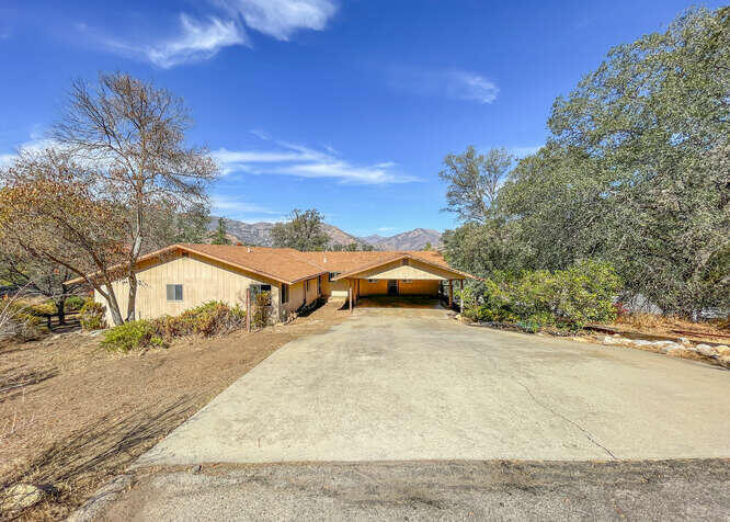 41000 Oak Ridge Drive Three Rivers, CA 93271 - Photo 2 of 39 a view of residential houses with wooden fence