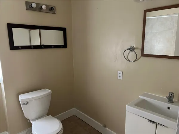 a bathroom with a toilet and sink