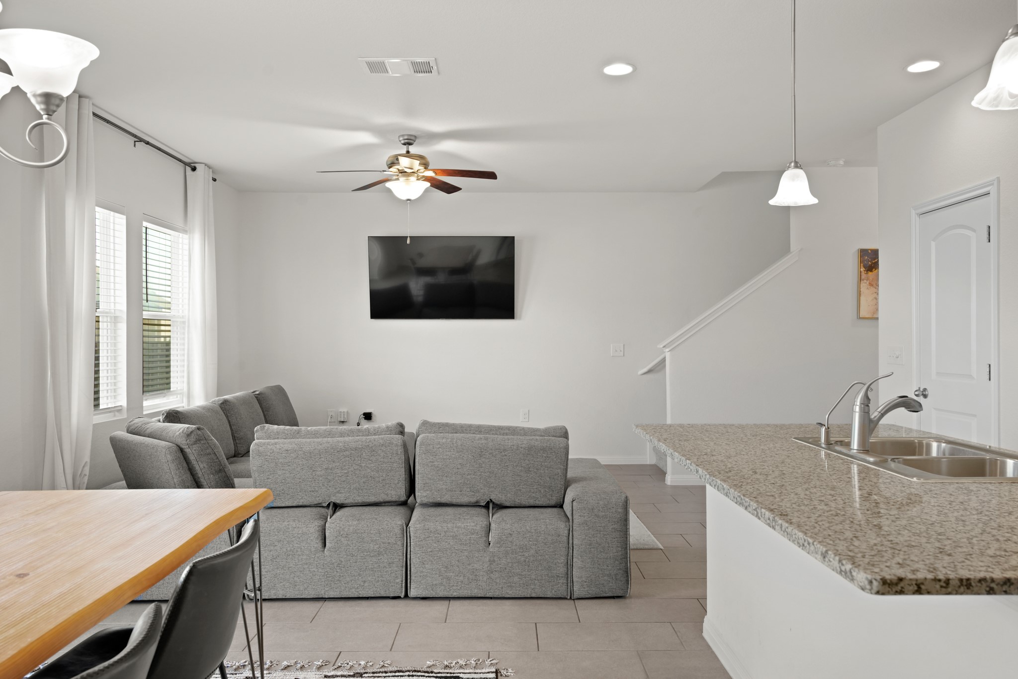 13005 Foreston Drive Austin, TX 78754 - Photo 12 of 36 a living room with furniture a flat screen tv and a window