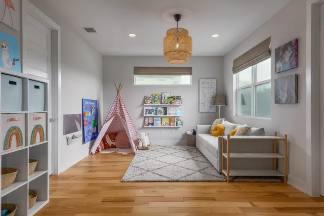 a living room with fireplace furniture and a wooden floor