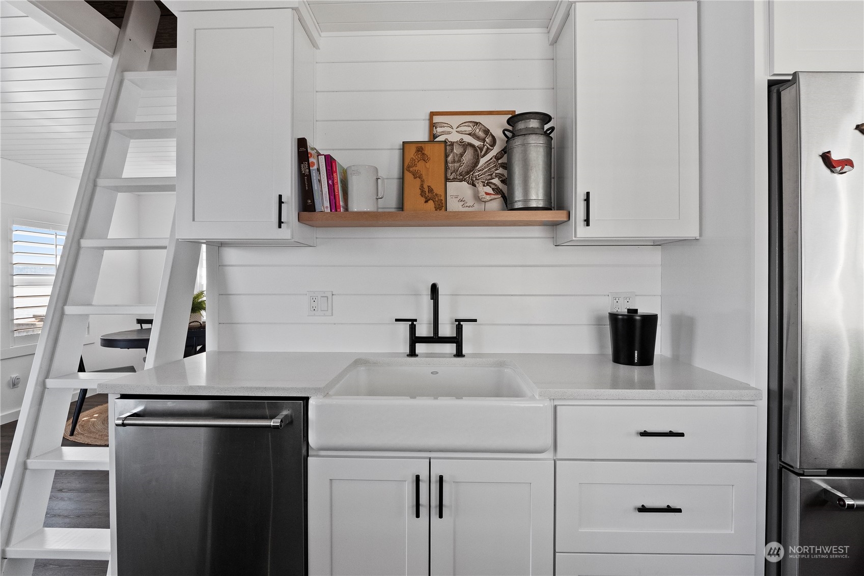 8003 Possession Beach Walk Clinton, WA 98236 - Photo 13 of 31 a kitchen with a refrigerator and cabinets