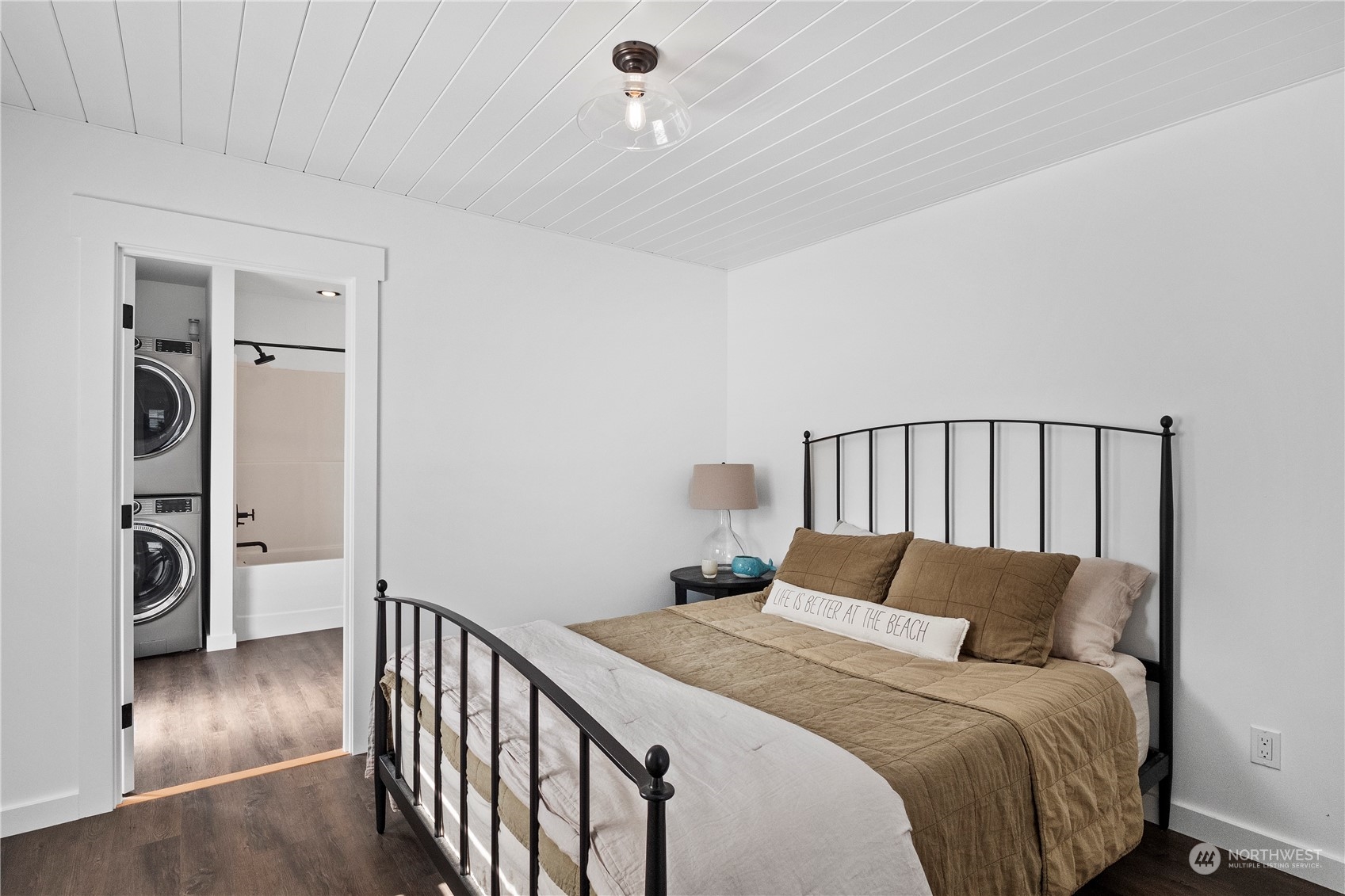 8003 Possession Beach Walk Clinton, WA 98236 - Photo 14 of 31 a bedroom with a bed and wooden floor