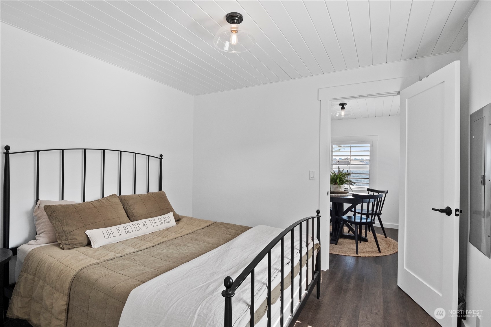 8003 Possession Beach Walk Clinton, WA 98236 - Photo 15 of 31 a bedroom with bed and wooden floor