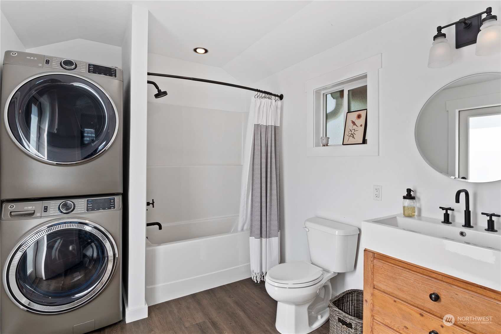 8003 Possession Beach Walk Clinton, WA 98236 - Photo 16 of 31 a bathroom with a sink mirror vanity and toilet