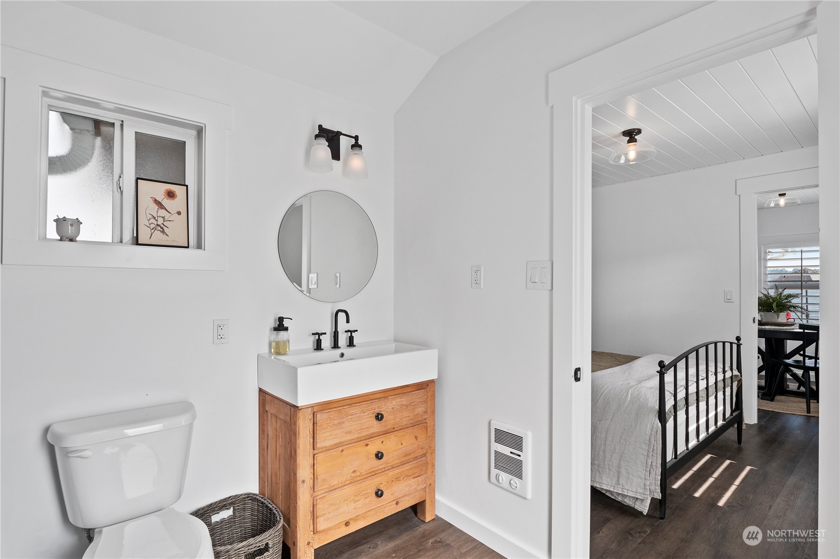 8003 Possession Beach Walk Clinton, WA 98236 - Photo 17 of 31 a bathroom with a toilet sink and mirror