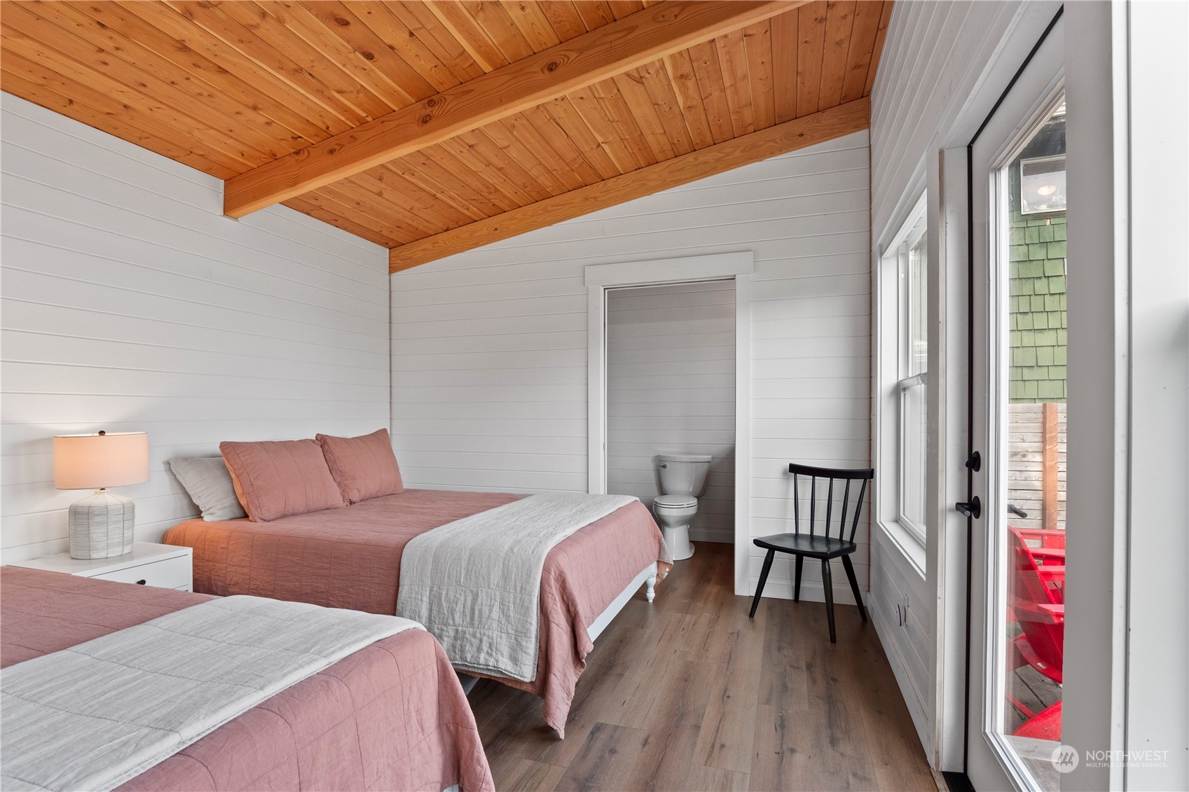 8003 Possession Beach Walk Clinton, WA 98236 - Photo 23 of 31 a bedroom with two beds and a mirror