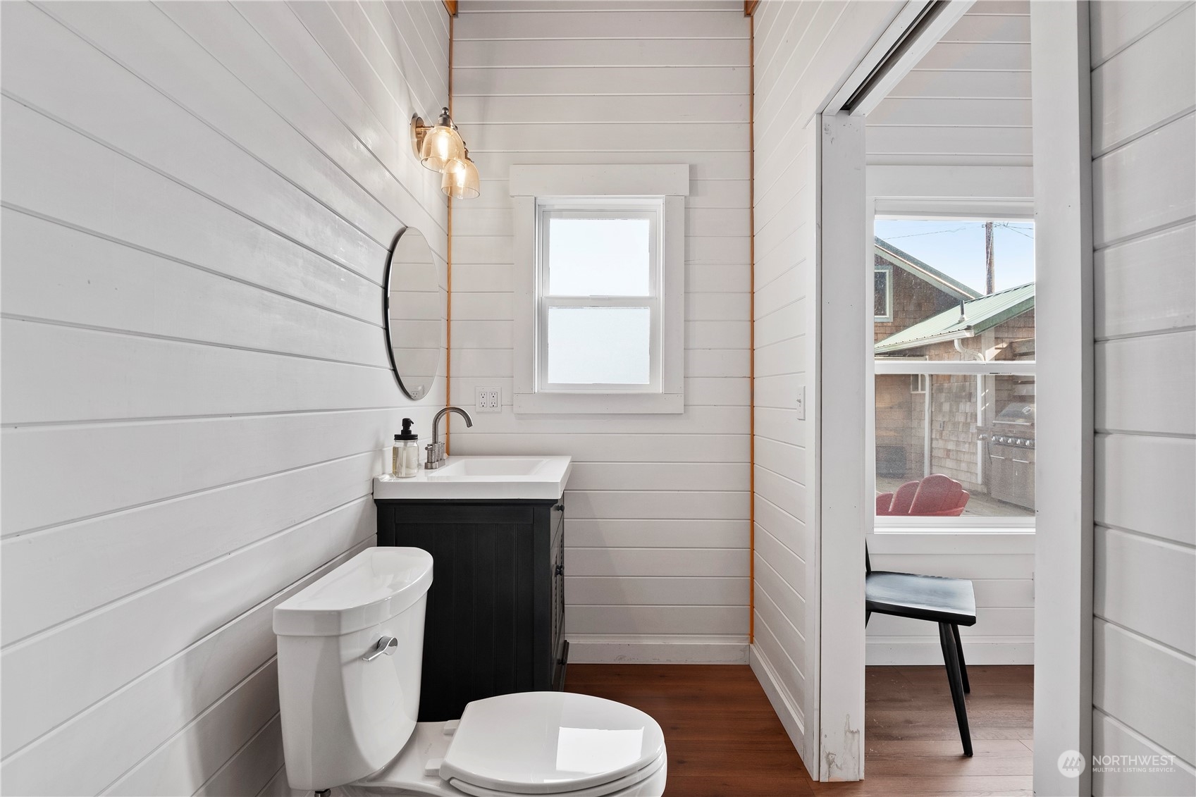 8003 Possession Beach Walk Clinton, WA 98236 - Photo 25 of 31 a bathroom with a toilet a sink and a window