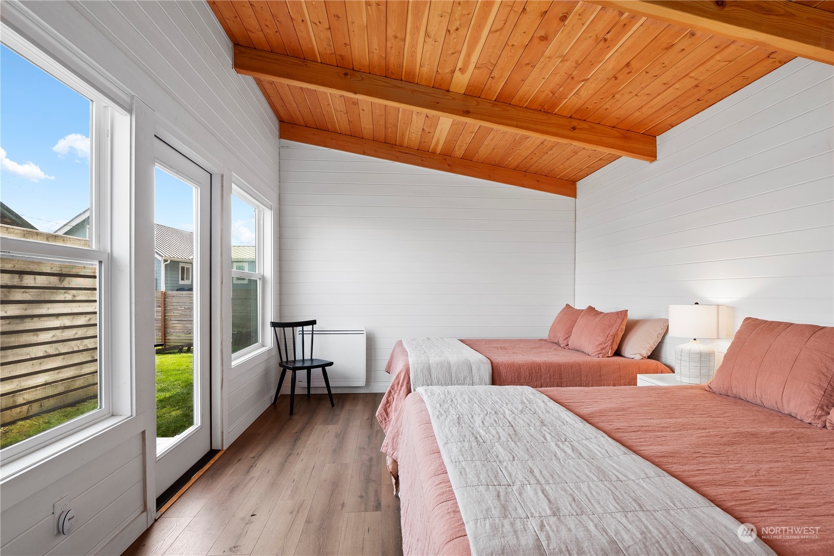 8003 Possession Beach Walk Clinton, WA 98236 - Photo 26 of 31 a bedroom with a bed and a view of balcony