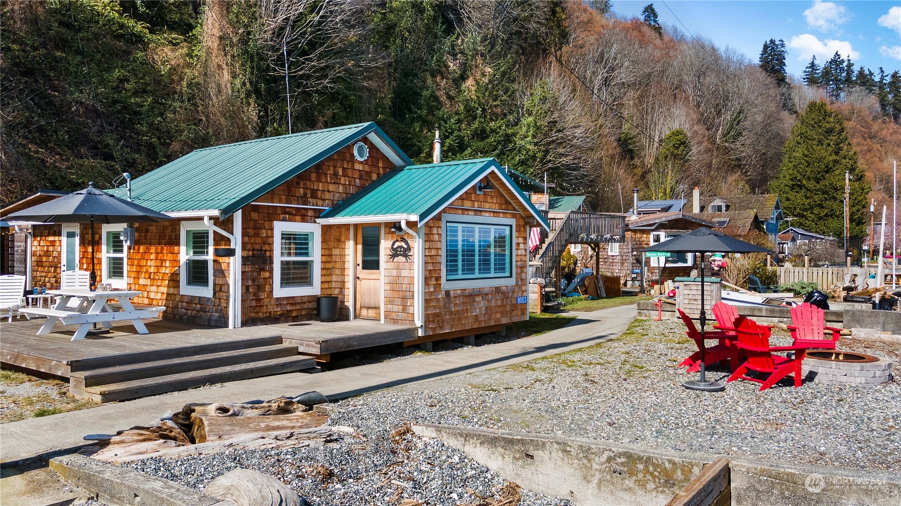 8003 Possession Beach Walk Clinton, WA 98236 - Photo 3 of 31 a front view of a house with sitting area