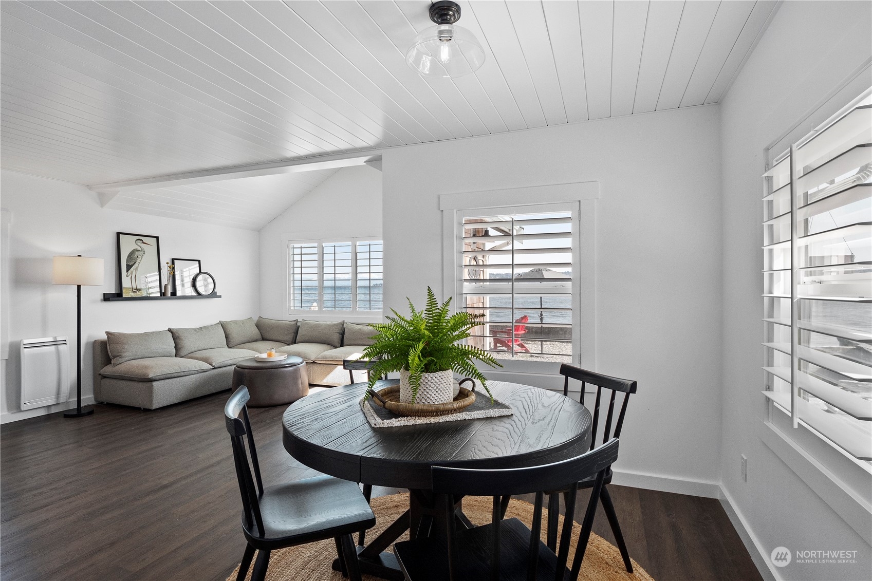 8003 Possession Beach Walk Clinton, WA 98236 - Photo 9 of 31 a view of a dining room with furniture window and wooden floor